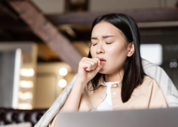 asianwomanbeingillcoughingfist 1596 4617 1765949711.jpg